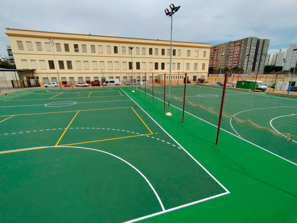 Obras de Construcción de 2 Pistas Polideportivas de resinas acrílicas en Colegio Portaceli, Sevilla